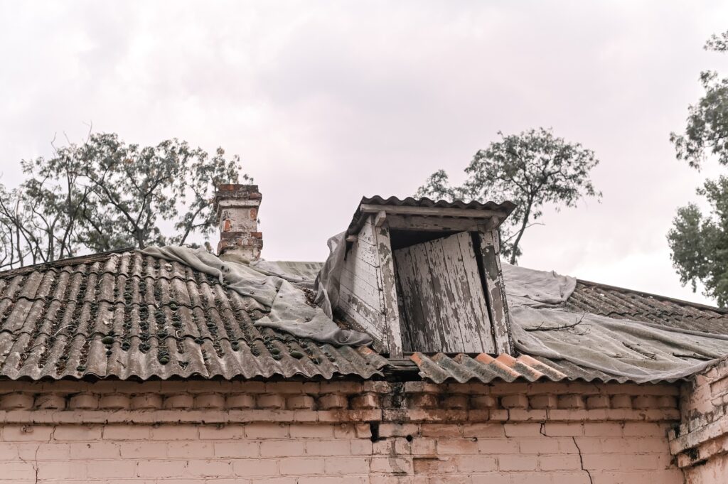 A crumbling old house. Collapsing wall and roof.